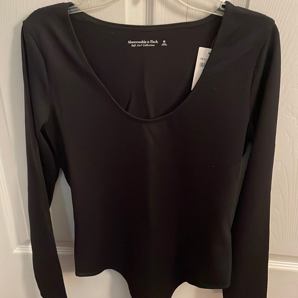 Black long sleeve body suit.
